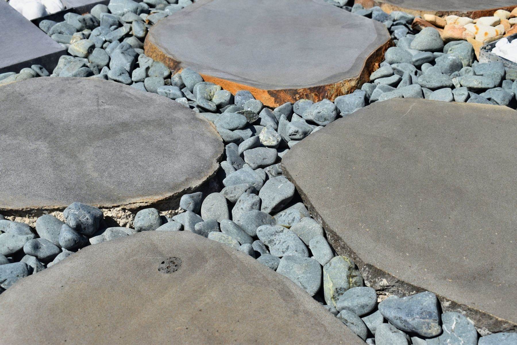 round bluestone stepping stones with bluestone pebbles in between