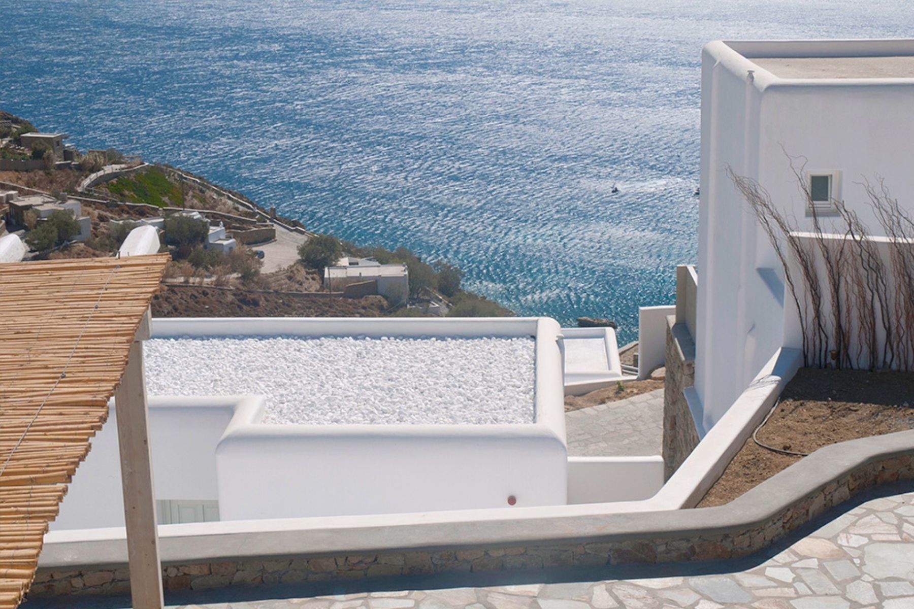 island roof top covered in white marble pebbles reflecting heat