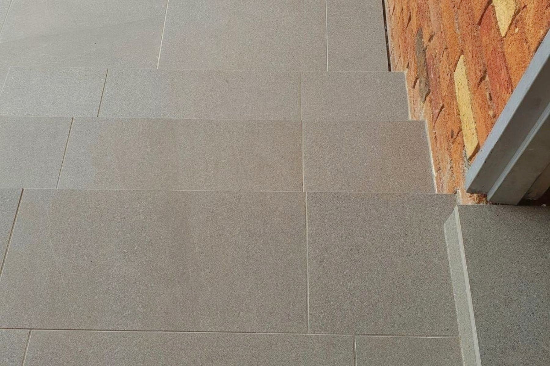 grey modern porcelain pavers used as step risers and treads