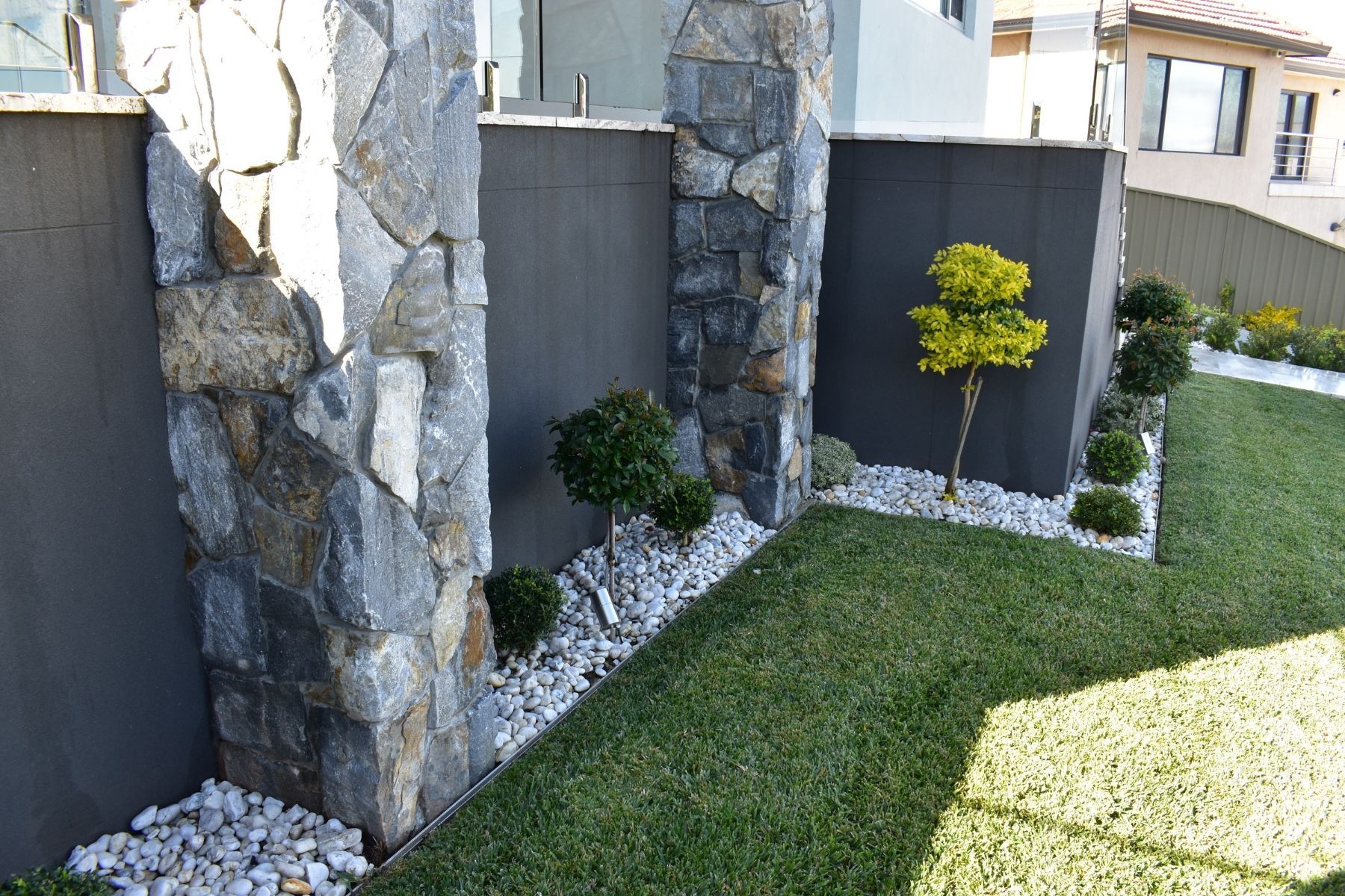 loose veneer columns surrounded by landscaping