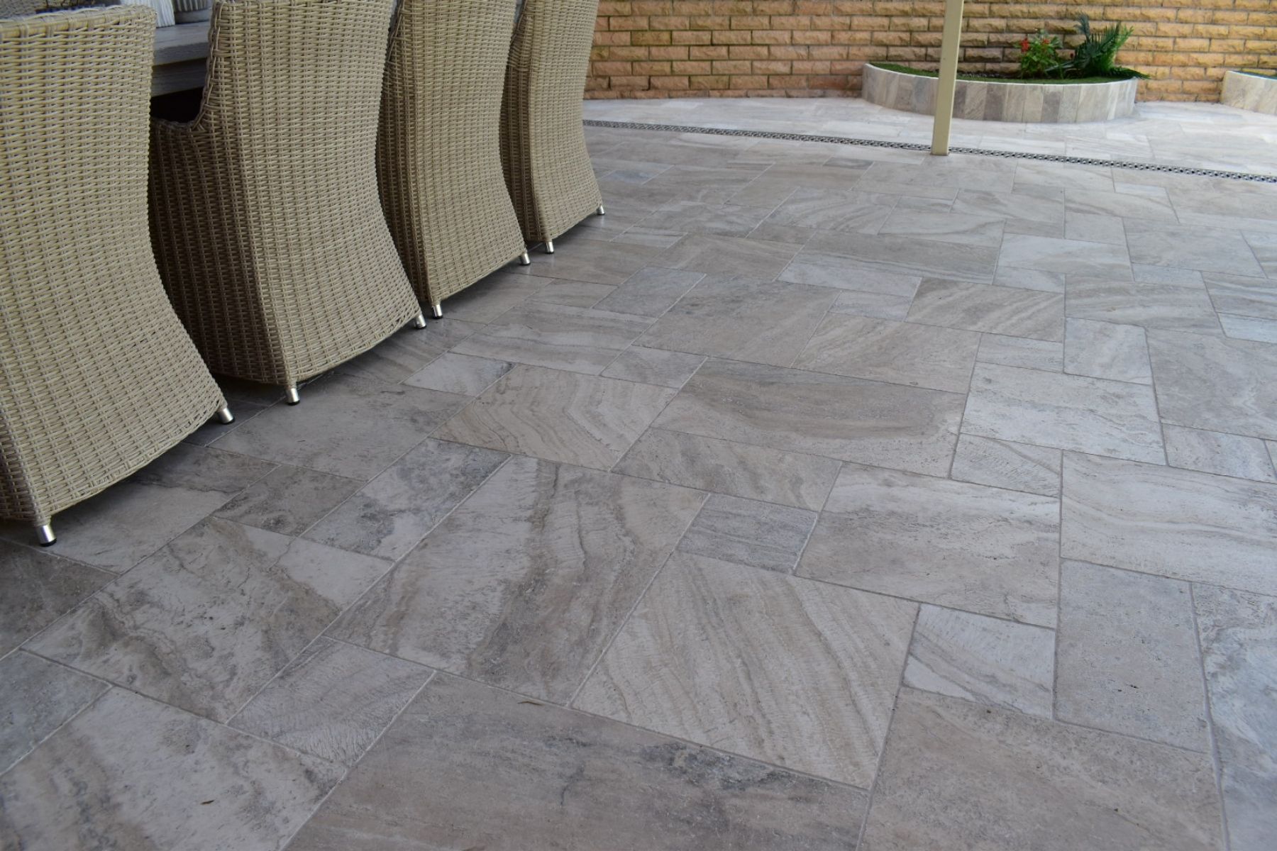 patio travertine used under patio with dining table and chairs