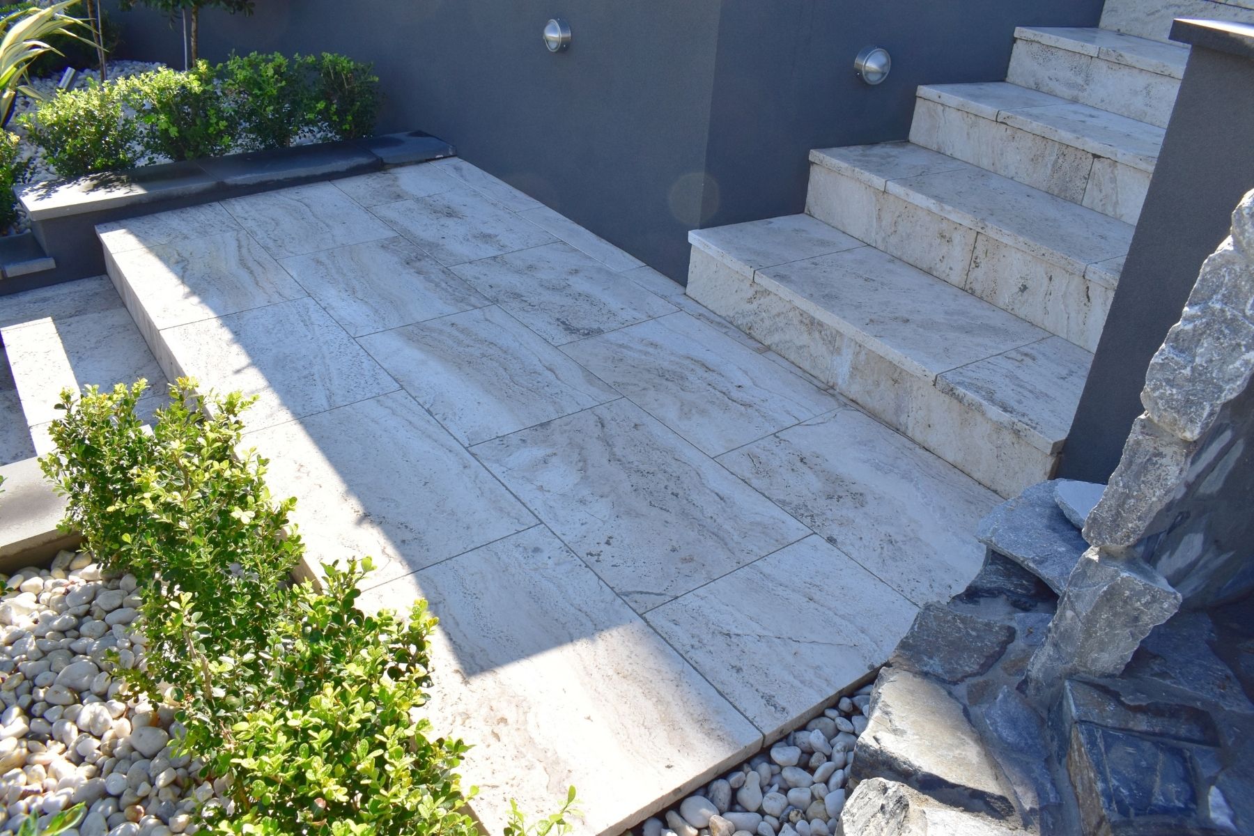 travertine stair case with landing area